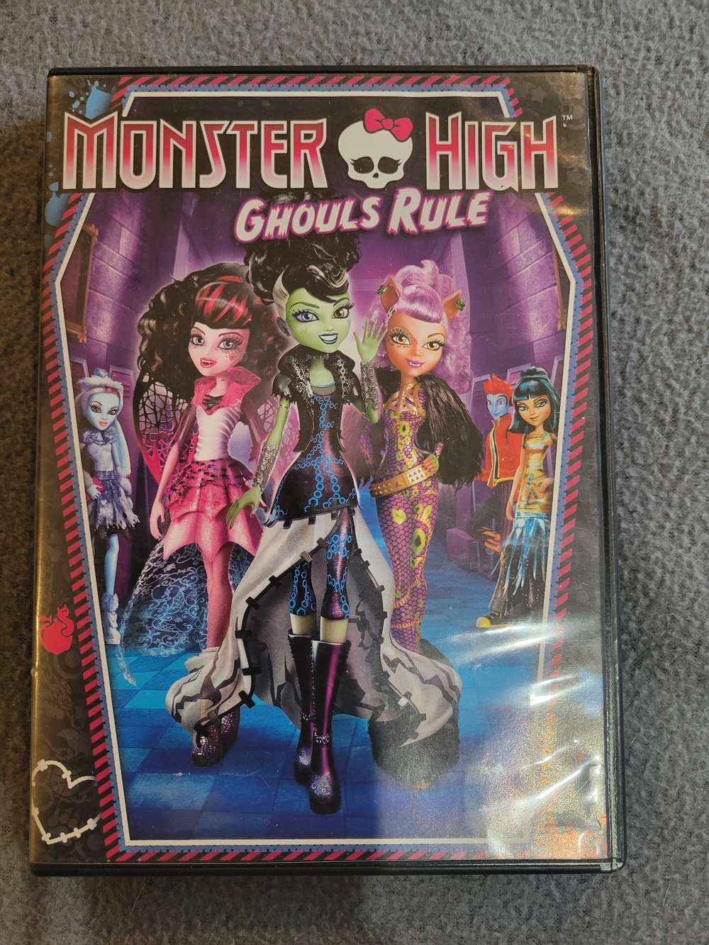 monster high DVD with purple, pink, green artwork
